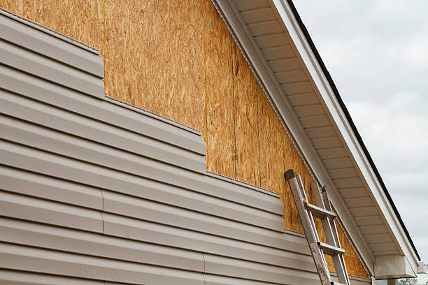 Professional Emergency Siding Repair technician working in White Cottage, OH